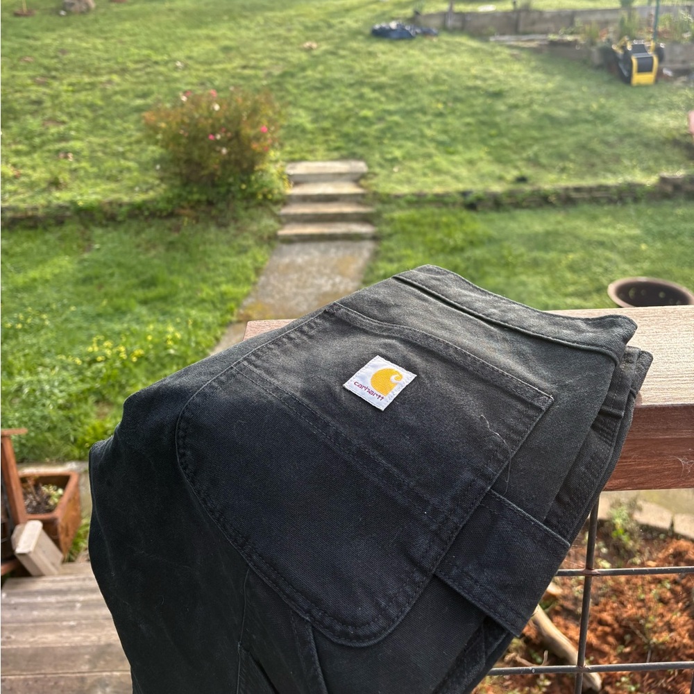 Carhartt black classic carpenter cargo pants.